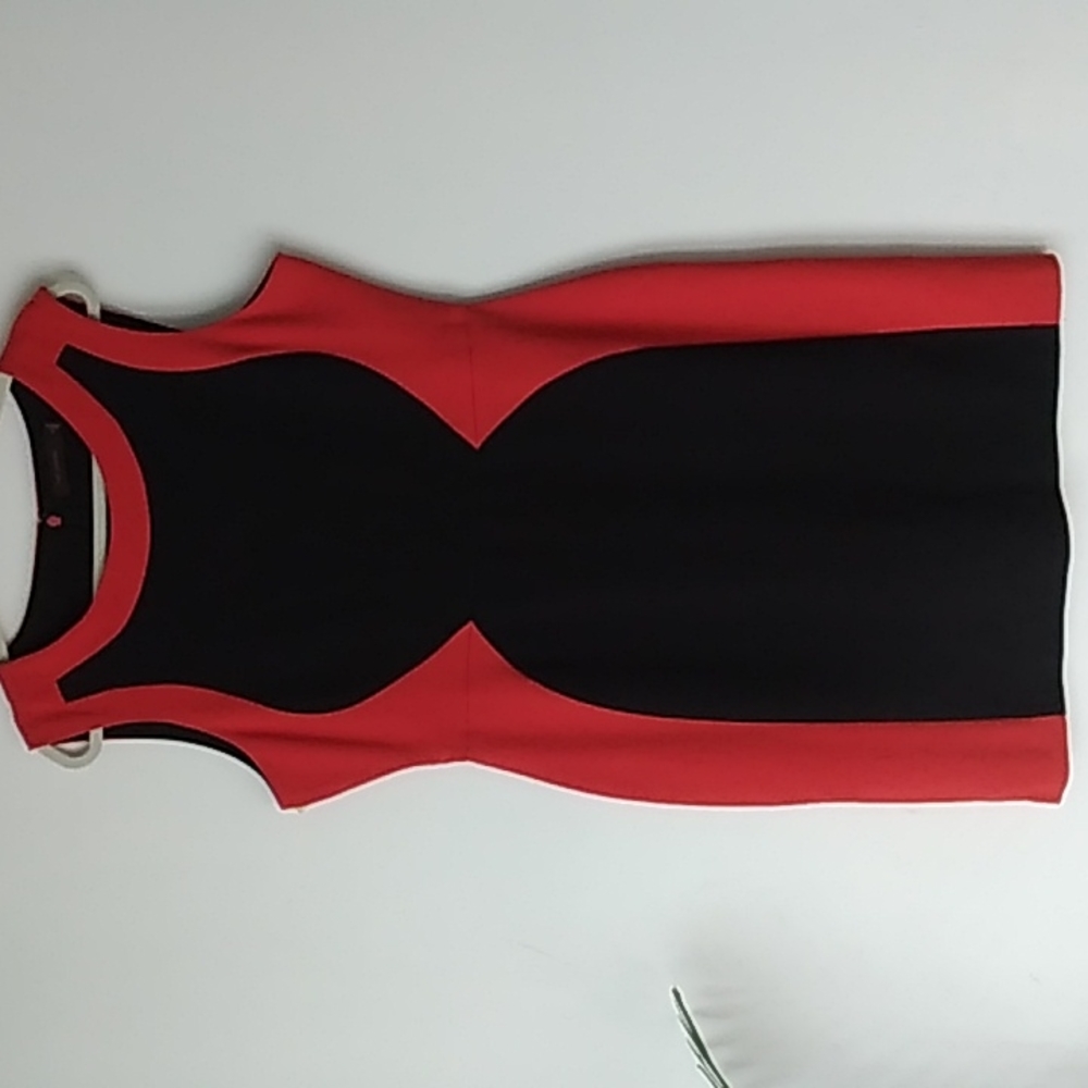 Limited women's dress size 14 and the color rust orange and black.